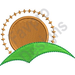 May include: An embroidered design featuring a stylized sun with a textured, circular center in shades of brown and gold. The sun is partially framed by a series of small, diamond-shaped accents. Below the sun is a green, curved shape, resembling a hill or landscape element.
