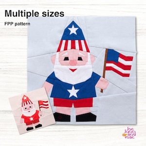 May include: A foundation paper piecing quilt pattern featuring a gnome wearing a red, white, and blue hat with a star, a blue shirt with a white star, and red shorts, holding a flag. Text reads: Multiple sizes, FPP pattern, Joe June and Mae.