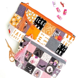 Patchwork zipper pouch sewing pattern in three sizes, the pouches are patchwork pouches, sewn with small fabric squares and contrast binding along the zipper with matching zippers. Zipper pouch sewing pattern