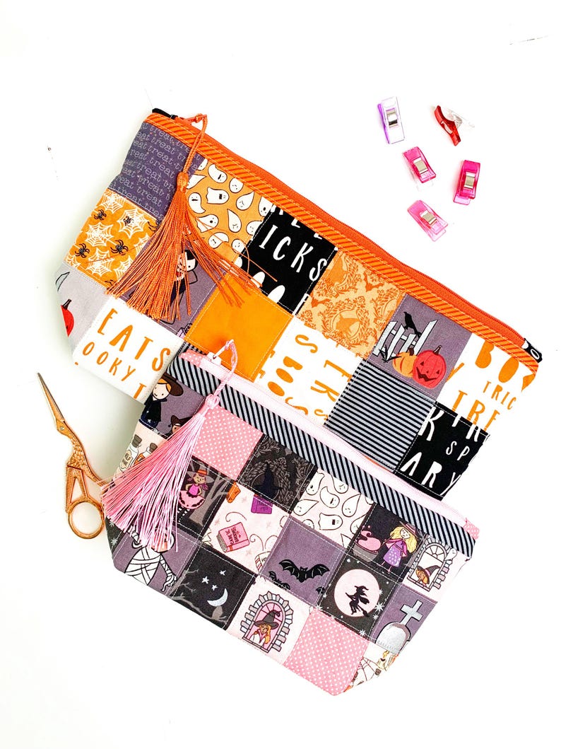 Patchwork zipper pouch sewing pattern in three sizes, the pouches are patchwork pouches, sewn with small fabric squares and contrast binding along the zipper with matching zippers. Zipper pouch sewing pattern