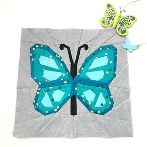 Butterfly Quilt Block Pattern, blue butterfly on grey background