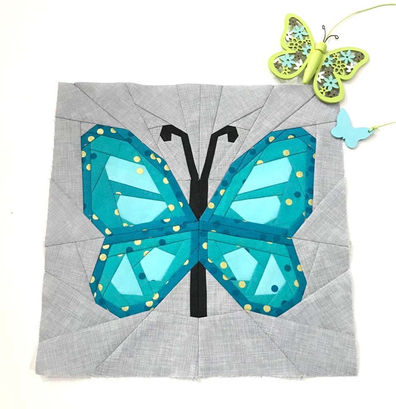Butterfly Quilt Block Pattern, blue butterfly on grey background