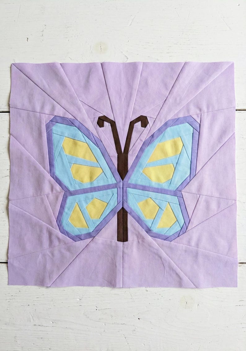 Butterfly quilt block pattern in 4 different sizes, perfect scrap buster, shown with sewing utensils