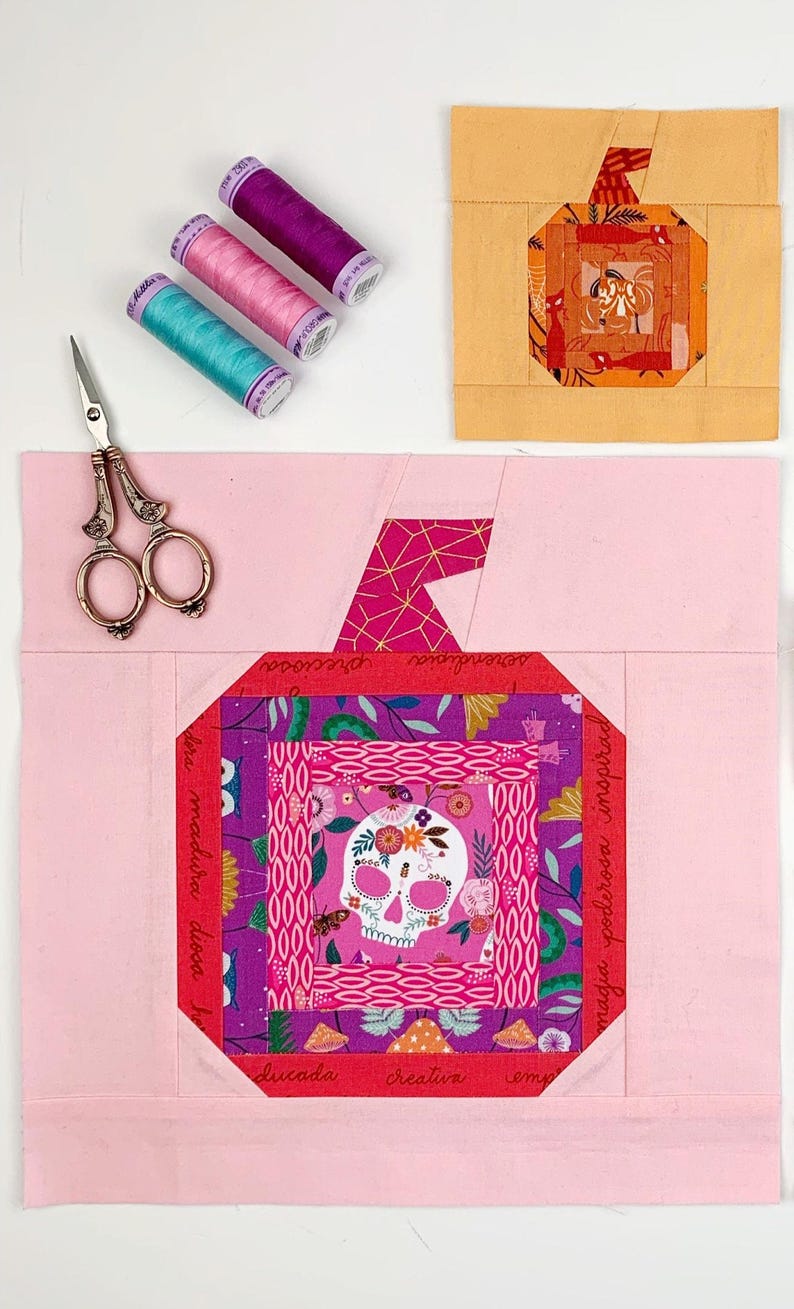 log cabin pumpkin quilt blocks in pink and orange colors on pink and orange background.log cabin pumpkin quilt block pattern in 5 different sizes, from 4x4 inch for ornaments to 6x6, 8x8, 10x10 and 12x12 inches for all sorts of amazing Halloween sewing projects. Use your favorite fabrics to fussy cut the center and turn these amazing beauties into your own pumpkin patch.