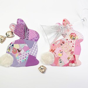bunny shaped placemat and coaster sewing pattern, sewn with fabric scraps in pink and purple with a fake fur little tail.