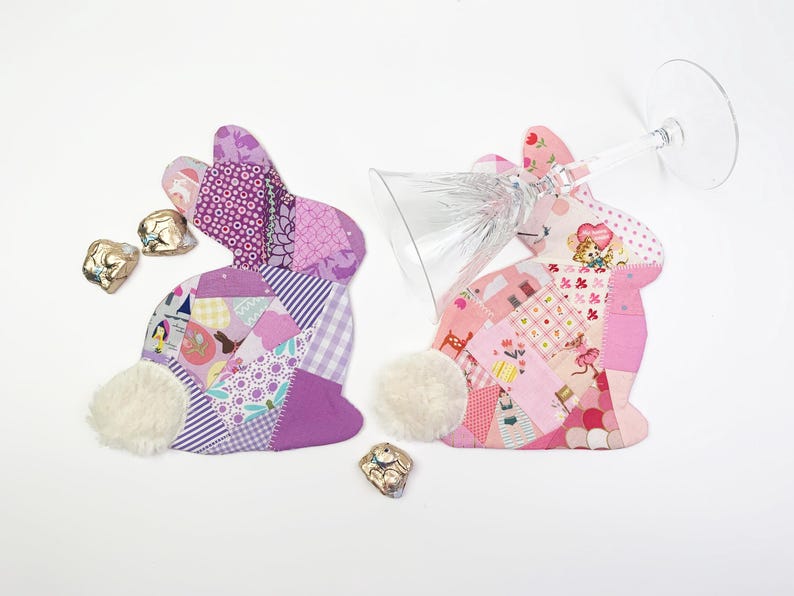 bunny shaped placemat and coaster sewing pattern, sewn with fabric scraps in pink and purple with a fake fur little tail.