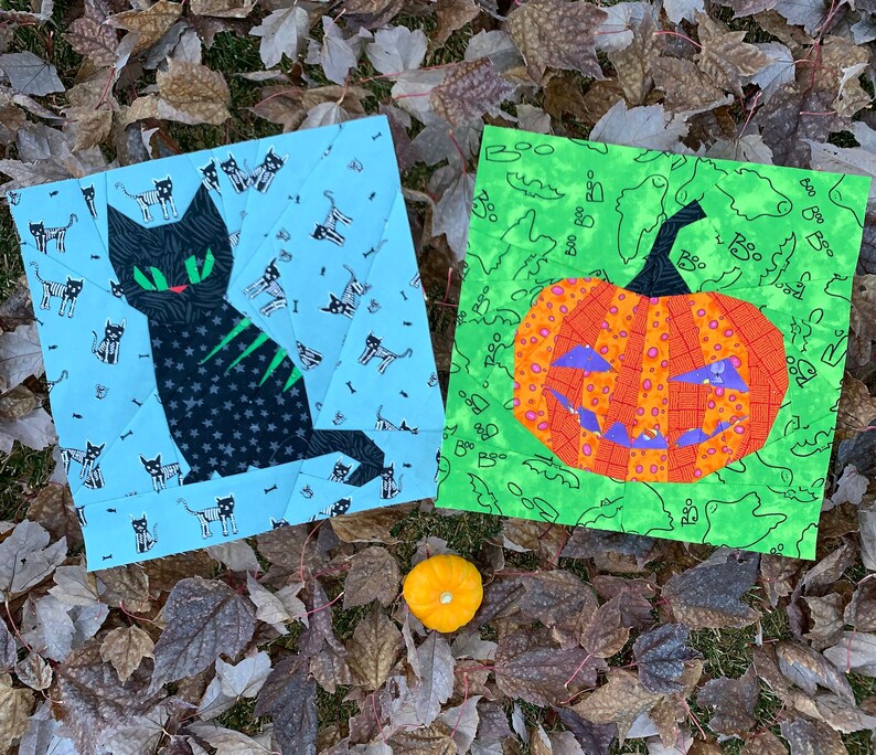 orange jack-o'-lantern quilt block on green background fabric