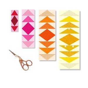 May include: Three fabric strips with a pattern of colorful triangles arranged in a chevron pattern. The strips are different colors: pink, orange, and yellow. A pair of gold scissors is also in the image.