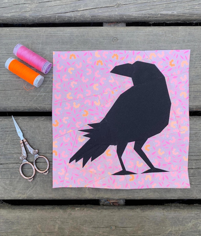 raven crow quilt block pattern black bird on pink background