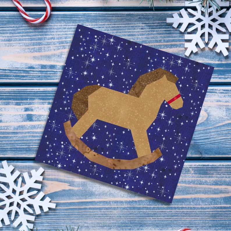 Rocking horse quilt block pattern, brown and red rocking horse on blue background