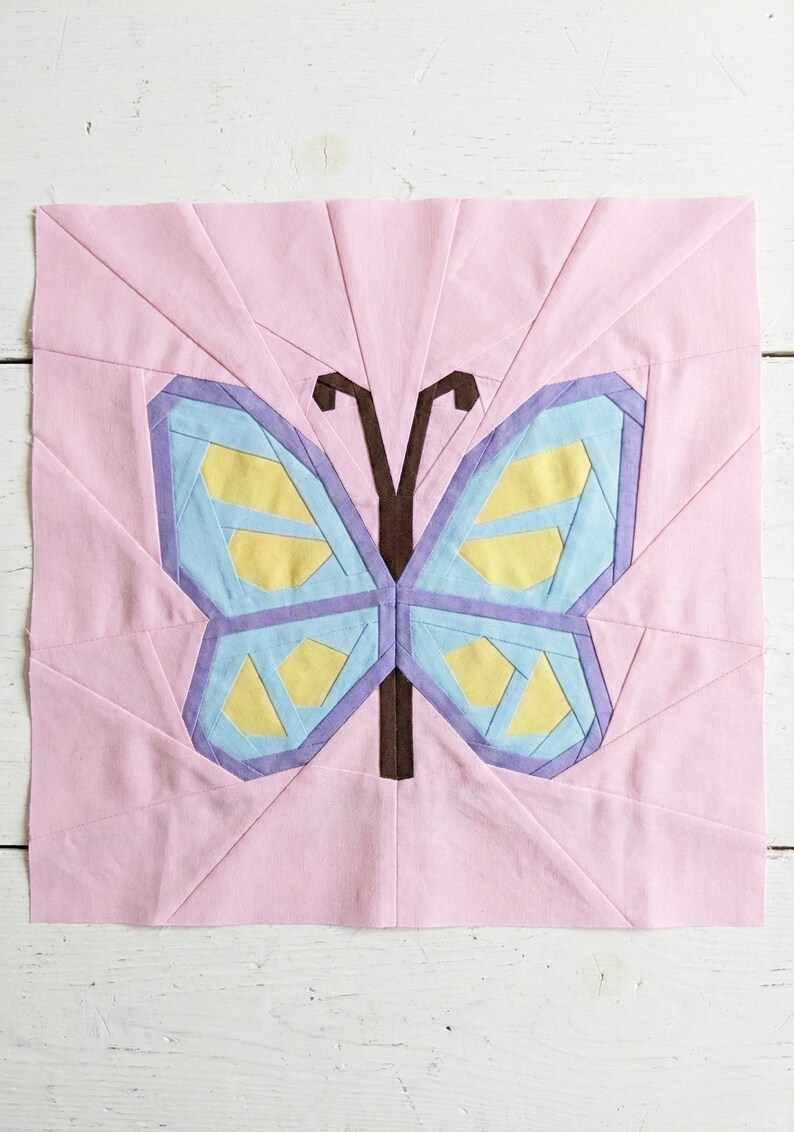 Butterfly quilt block pattern in 4 different sizes, perfect scrap buster, shown with sewing utensils