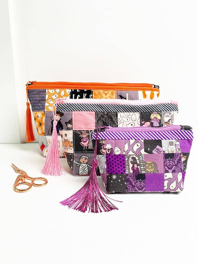 Patchwork zipper pouch sewing pattern in three sizes, the pouches are patchwork pouches, sewn with small fabric squares and contrast binding along the zipper with matching zippers. Zipper pouch sewing pattern
