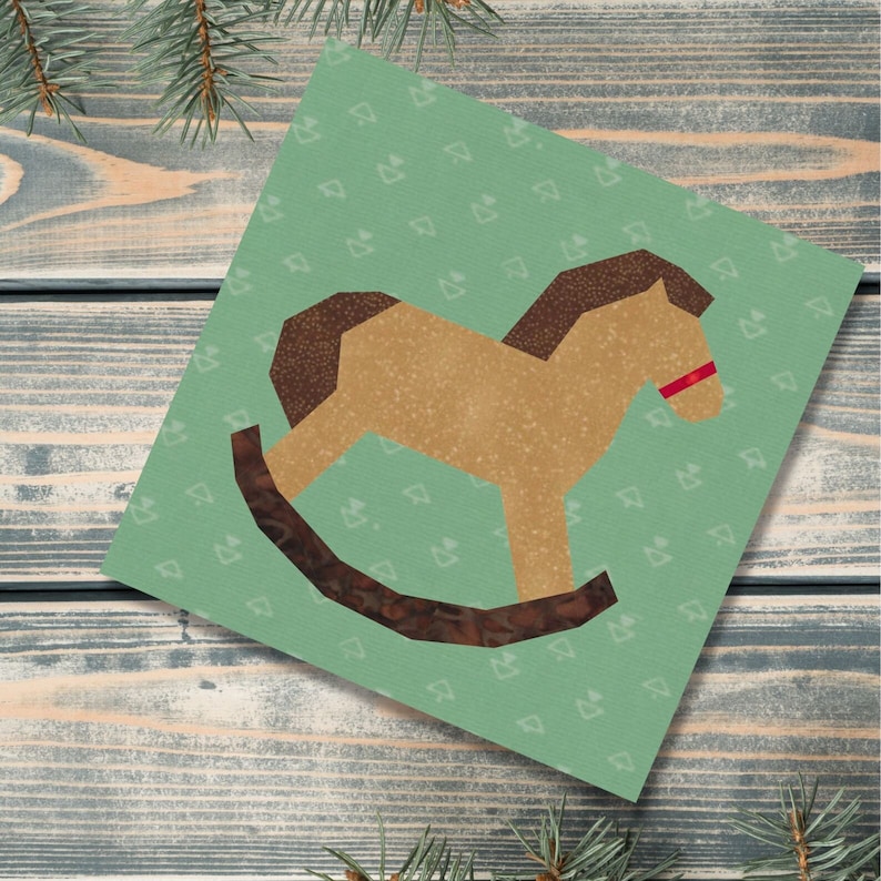 Rocking horse quilt block pattern, brown and red rocking horse on green background