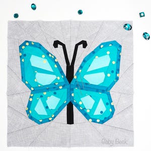 Butterfly quilt block pattern in 4 different sizes, perfect scrap buster, shown with sewing utensils