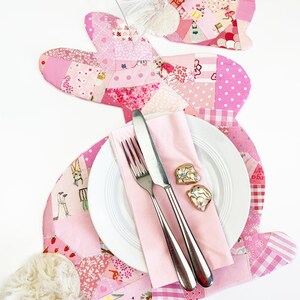 bunny shaped placemat and coaster sewing pattern, sewn with fabric scraps in pink with a fake fur little tail.