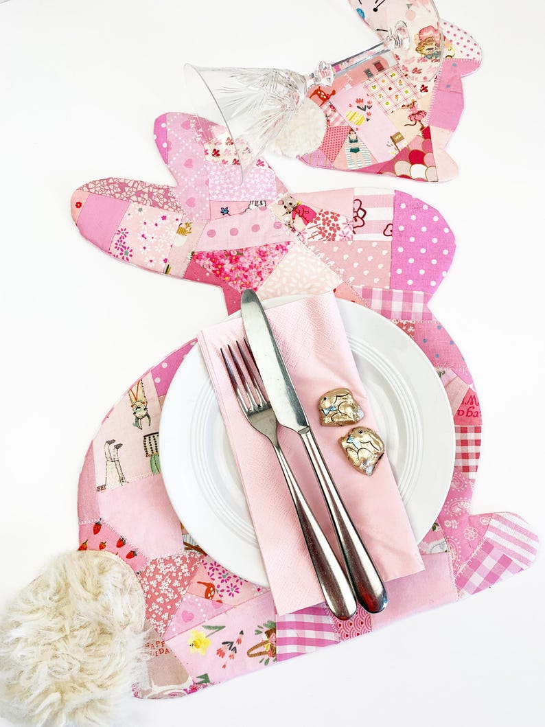 bunny shaped placemat and coaster sewing pattern, sewn with fabric scraps in pink with a fake fur little tail.