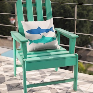 Sardines Quilt block pattern, used to make a super sunny summer pillow with two sardines. The colors are blue and turquoise on a bright sunny turquoise colored Adirondack chair.