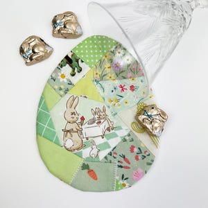 Patched Easter Egg placemat and Coaster/ Mug rug pattern. These are made out of random fabric scraps, they're the perfect scrap busters.