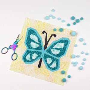 Butterfly quilt block pattern in 4 different sizes, perfect scrap buster, shown with sewing utensils