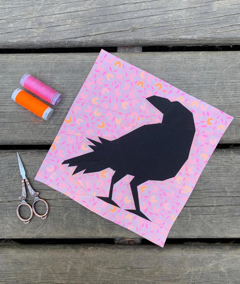 raven crow quilt block pattern black bird on pink background