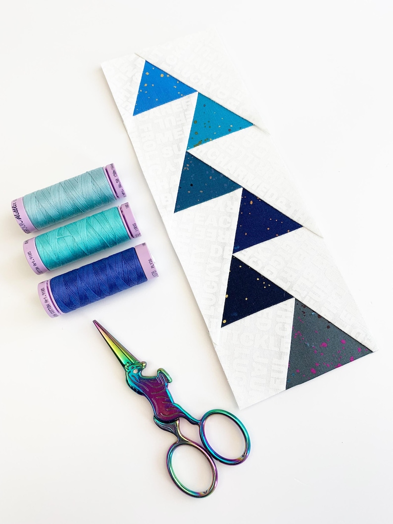 offset Flying geese quilt blocks in pinks, blues and yellows. These Jumping flying geese are perfect for quilt borders, and to enhance any quilt block.