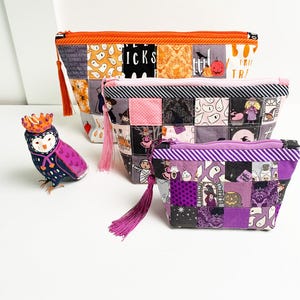 Patchwork zipper pouch sewing pattern in three sizes, the pouches are patchwork pouches, sewn with small fabric squares and contrast binding along the zipper with matching zippers. Zipper pouch sewing pattern