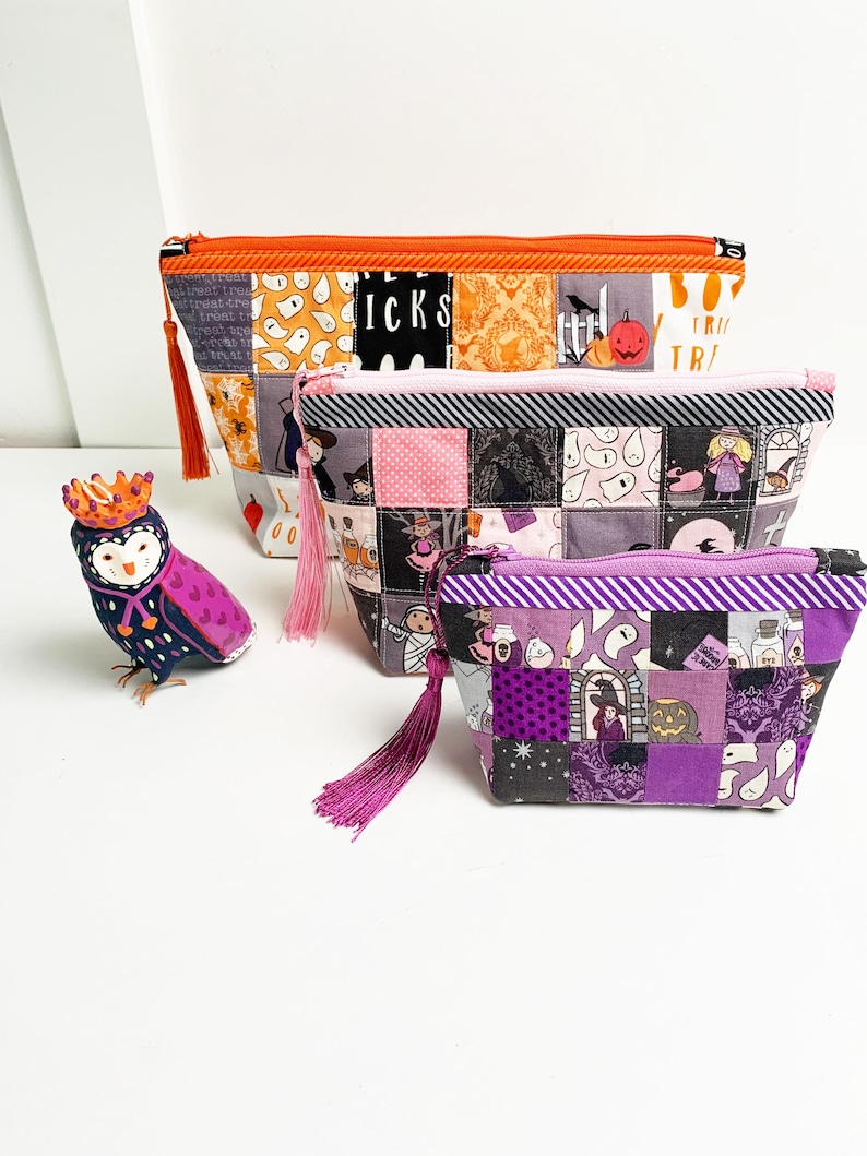 Patchwork zipper pouch sewing pattern in three sizes, the pouches are patchwork pouches, sewn with small fabric squares and contrast binding along the zipper with matching zippers. Zipper pouch sewing pattern