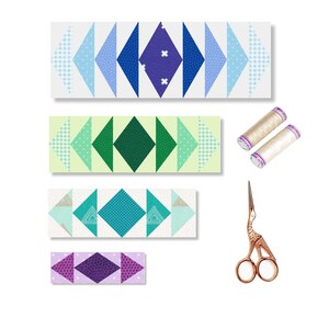 May include: Four strips of fabric with a geometric pattern of triangles and diamonds in shades of blue, green, teal, and purple. The fabric strips are arranged vertically, with the blue strip at the top and the purple strip at the bottom. Two spools of white thread and a pair of gold-colored scissors are also shown.