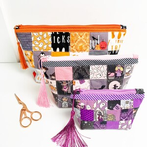 Patchwork zipper pouch sewing pattern in three sizes, the pouches are patchwork pouches, sewn with small fabric squares and contrast binding along the zipper with matching zippers. Zipper pouch sewing pattern