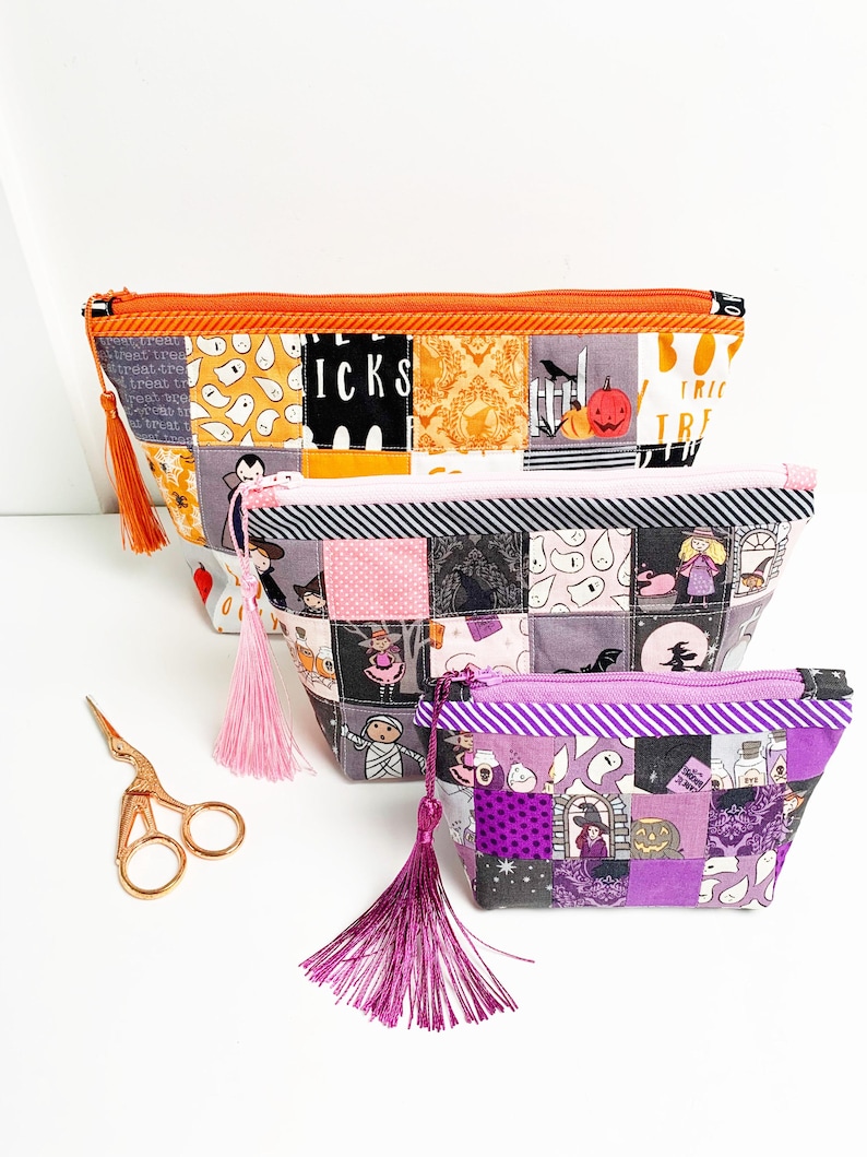 Patchwork zipper pouch sewing pattern in three sizes, the pouches are patchwork pouches, sewn with small fabric squares and contrast binding along the zipper with matching zippers. Zipper pouch sewing pattern