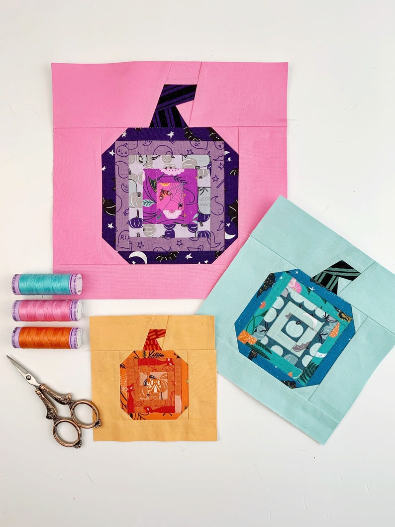 log cabin pumpkin quilt block pattern in 5 different sizes, from 4x4 inch for ornaments to 6x6, 8x8, 10x10 and 12x12 inches for all sorts of amazing Halloween sewing projects. Use your favorite fabrics to fussy cut the center and turn these amazing beauties into your own pumpkin patch.