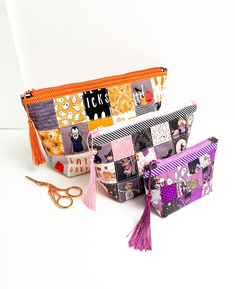 Patchwork zipper pouch sewing pattern in three sizes, the pouches are patchwork pouches, sewn with small fabric squares and contrast binding along the zipper with matching zippers. Zipper pouch sewing pattern