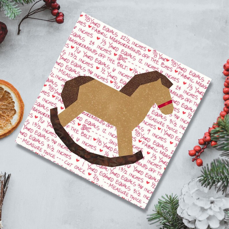 Rocking horse quilt block pattern, brown and red rocking horse on multicolored background