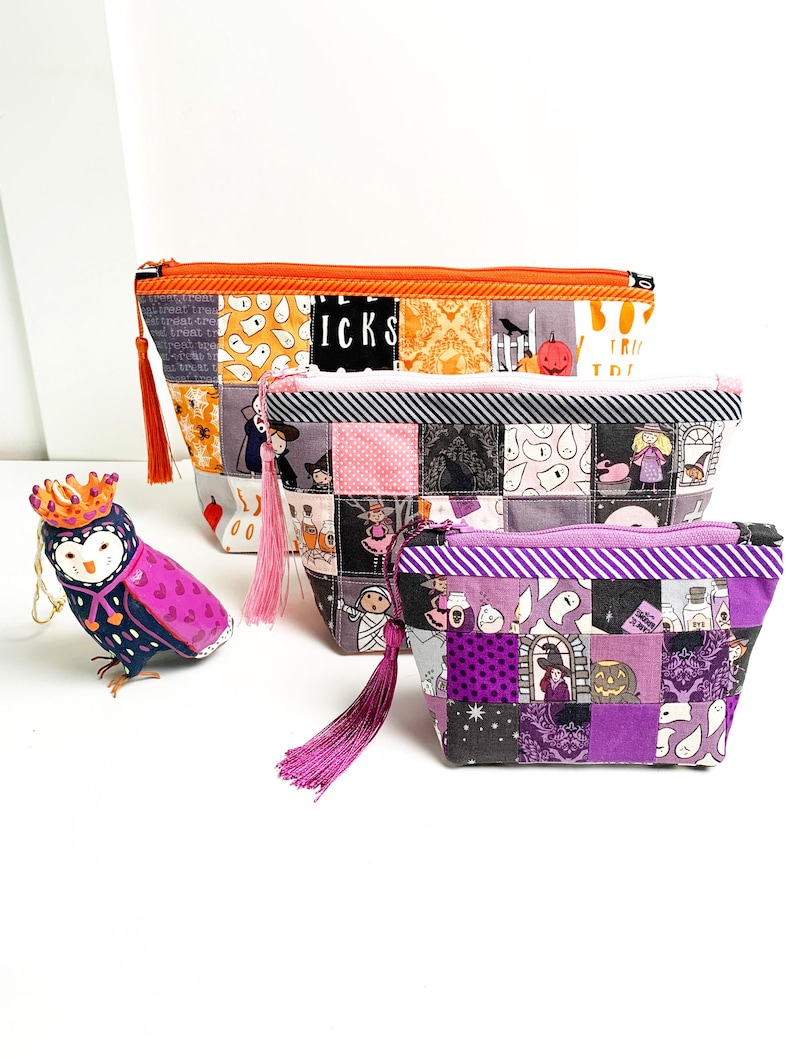 Patchwork zipper pouch sewing pattern in three sizes, the pouches are patchwork pouches, sewn with small fabric squares and contrast binding along the zipper with matching zippers. Zipper pouch sewing pattern