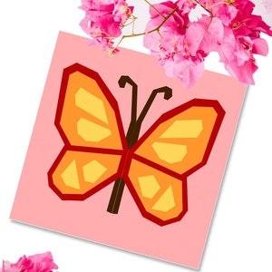butterfly quilt block pattern in reds and oranges