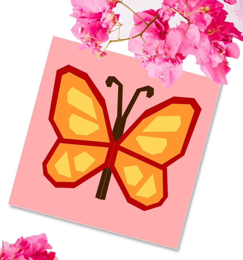 butterfly quilt block pattern in reds and oranges