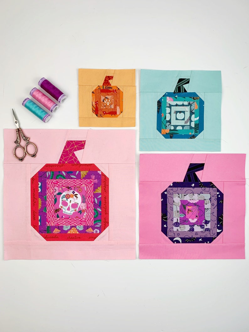 log cabin pumpkin quilt blocks in teal, pink and orange colors on mint, rose and orange background.log cabin pumpkin quilt block pattern in 5 different sizes, from 4x4 inch for ornaments to 6x6, 8x8, 10x10 and 12x12 inches for all sorts of amazing Halloween sewing projects. Use your favorite fabrics to fussy cut the center and turn these amazing beauties into your own pumpkin patch.