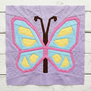 Butterfly quilt block pattern in 4 different sizes, perfect scrap buster, shown with sewing utensils