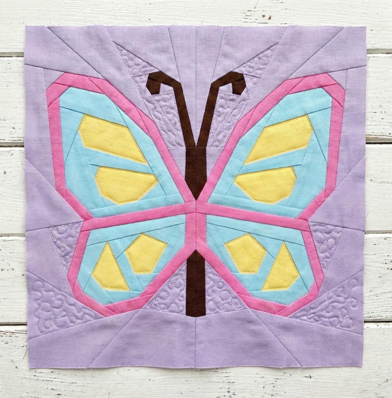 Butterfly quilt block pattern in 4 different sizes, perfect scrap buster, shown with sewing utensils