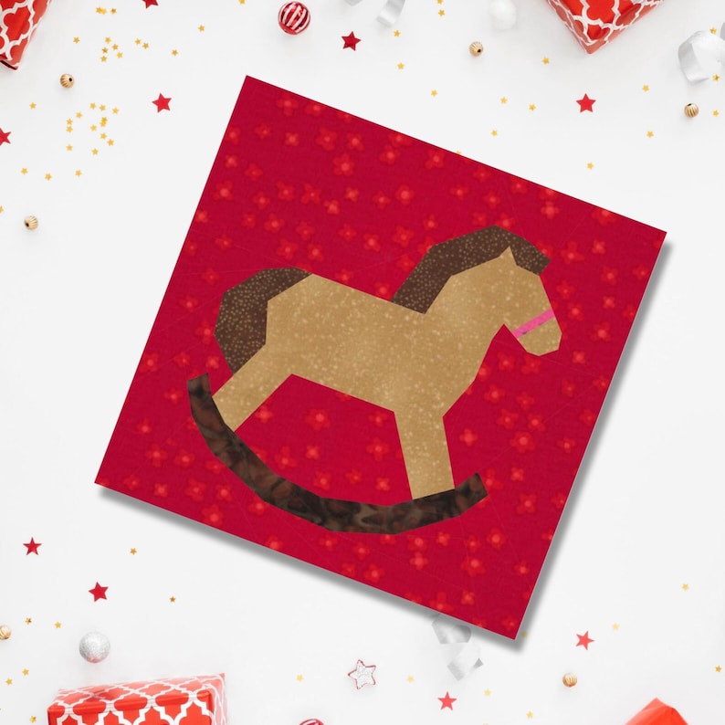 Rocking horse quilt block pattern, brown and pink rocking horse on red background