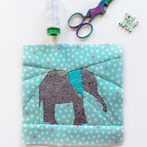 elephant quilt block pattern , baby elephant in gray on blue background