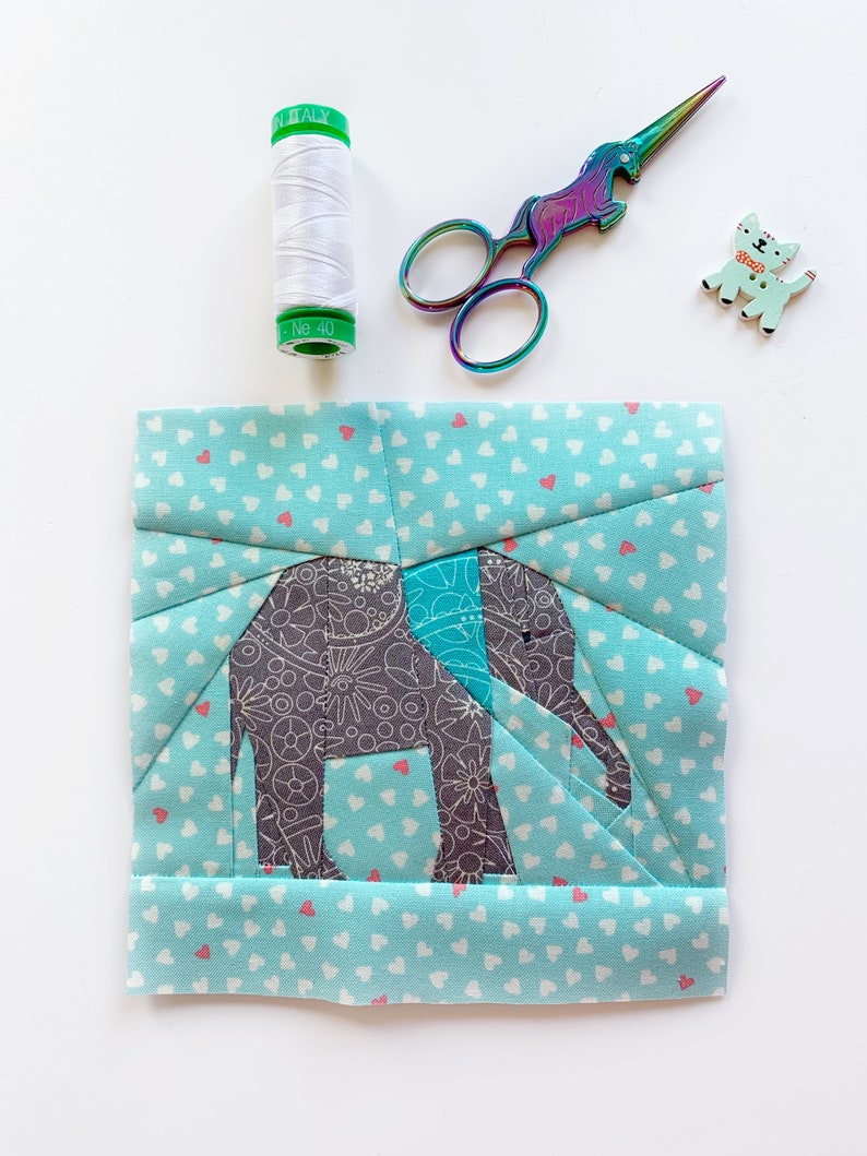 elephant quilt block pattern , baby elephant in gray on blue background