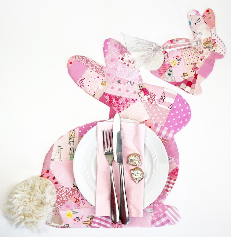 bunny shaped placemat and coaster sewing pattern, sewn with fabric scraps in pink with a fake fur little tail.