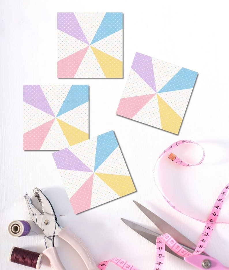 Kaleidoscope quilt block pattern in pastel colors with sewing notions in the background