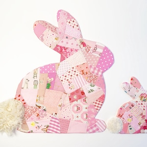 bunny shaped placemat and coaster sewing pattern, sewn with fabric scraps in pink with a fake fur little tail.