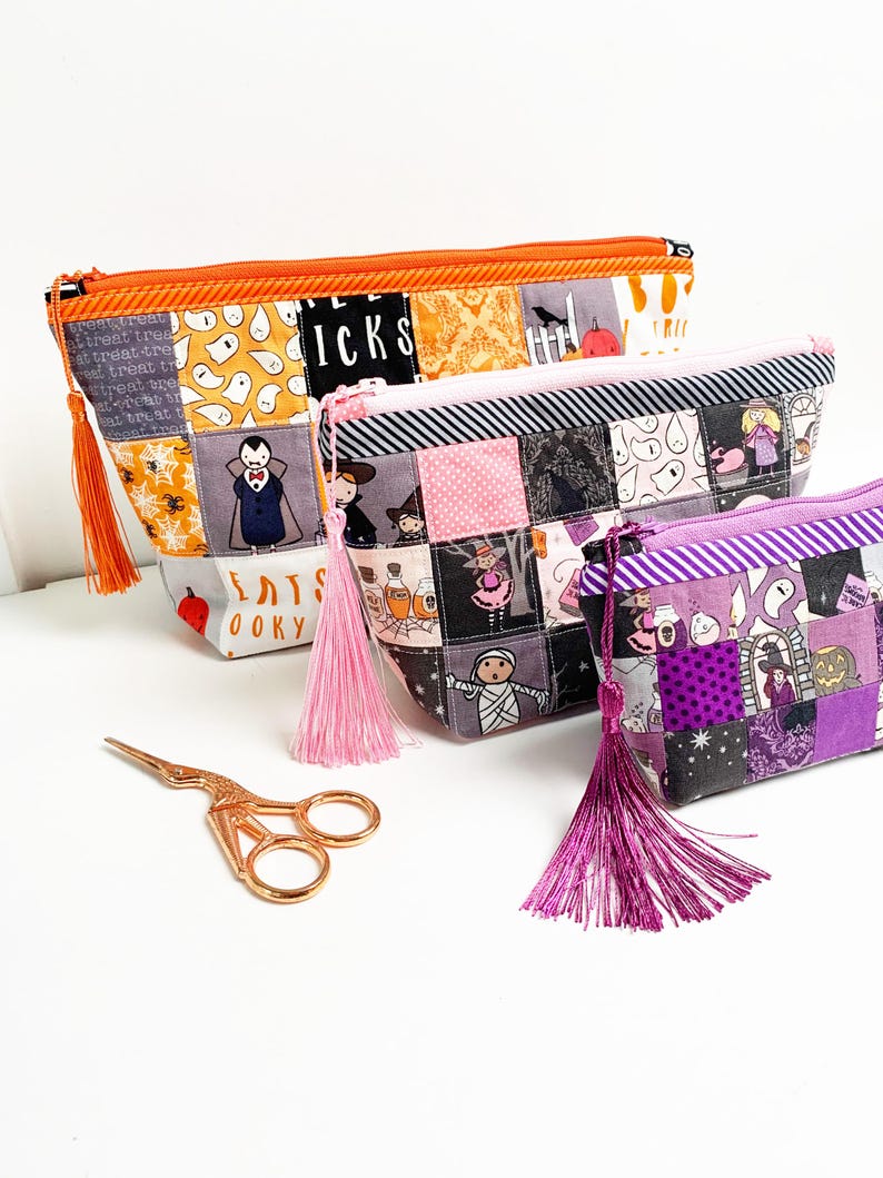 Patchwork zipper pouch sewing pattern in three sizes, the pouches are patchwork pouches, sewn with small fabric squares and contrast binding along the zipper with matching zippers. Zipper pouch sewing pattern