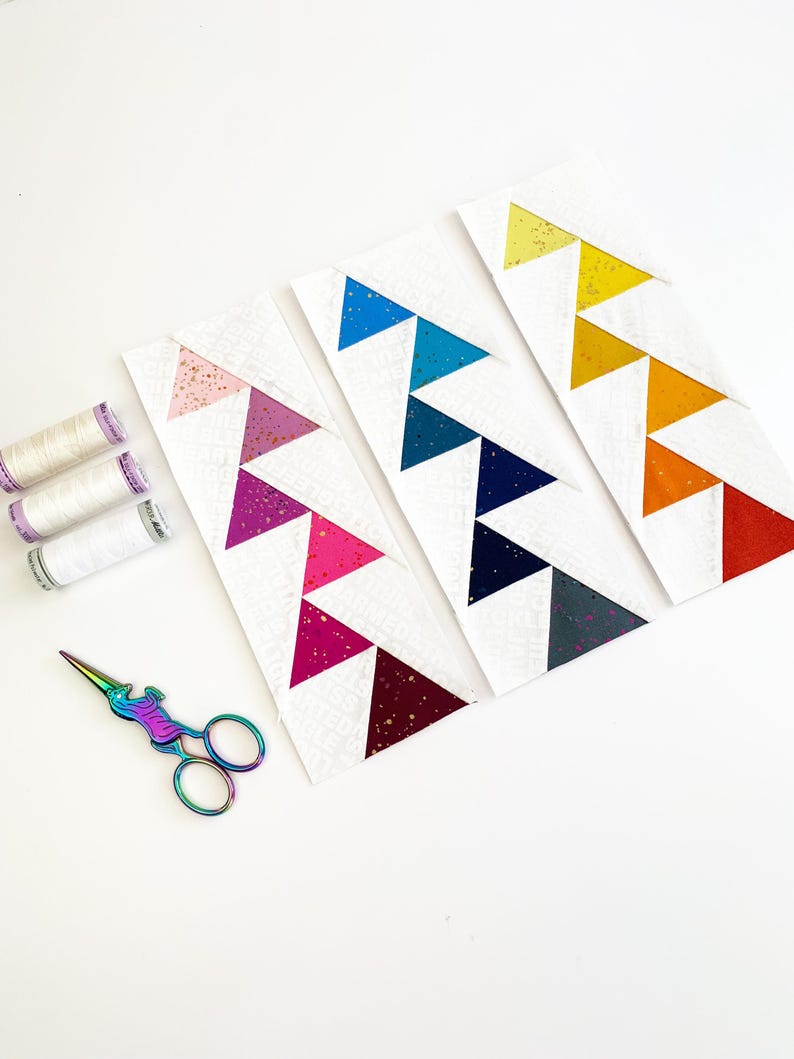 offset Flying geese quilt blocks in pinks, blues and yellows. These Jumping flying geese are perfect for quilt borders, and to enhance any quilt block.