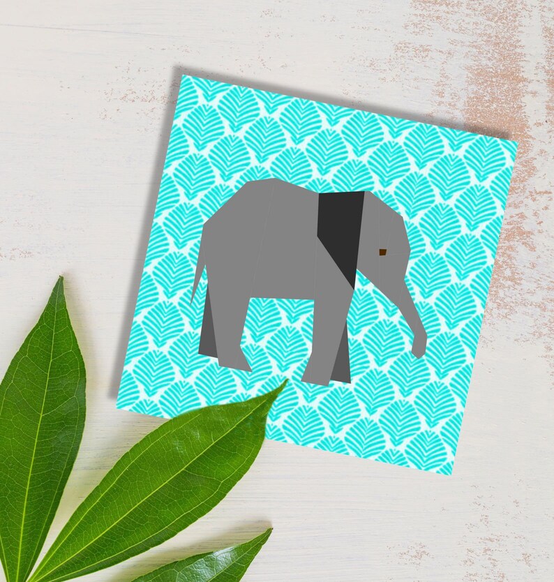 elephant quilt block pattern , baby elephant in gray on blue background