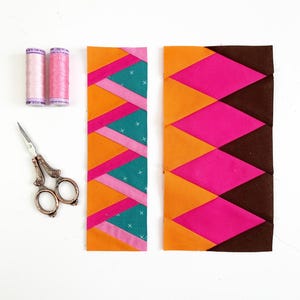 May include: Two strips of fabric with a geometric pattern of orange, pink, teal, and brown triangles. Two spools of pink thread and a pair of silver scissors are also pictured.
