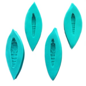 May include: Four teal blue silicone moulds shaped like leaves with a detailed shrimp design inside each mould.
